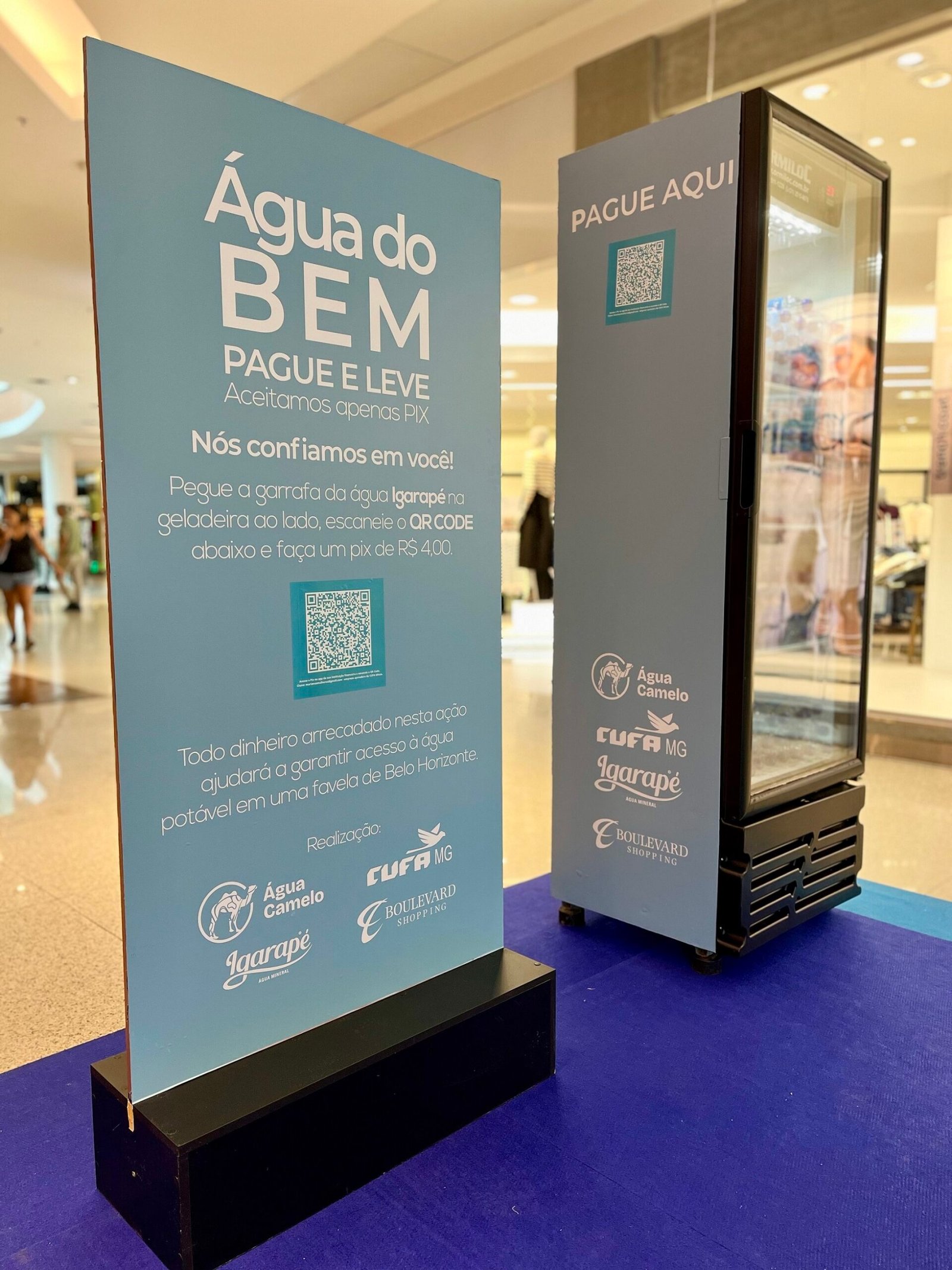 AÇÃO DO BOULEVARD SHOPPING BH LEVA ÁGUA   POTÁVEL PARA FAMÍLIAS DA FAVELA DO SUMARÉ